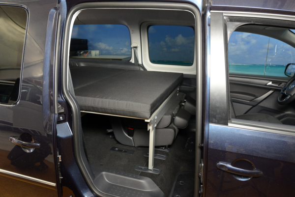 Sleeping system with rear seat in VW Caddy 3 4 5 Ford Tourneo Connect 3 side view