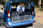 Preview: VanEssa Schlafsystem Doppelbett VW Caddy 5 Ford Tourneo Connect 3 Heckansicht mit Kueche Outdoor