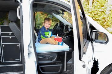 VanEssa cot in the cockpit of the Mercedes van