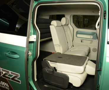 VanEssa Surfer sleeping system in the VW ID Buzz side view packing state with back seats