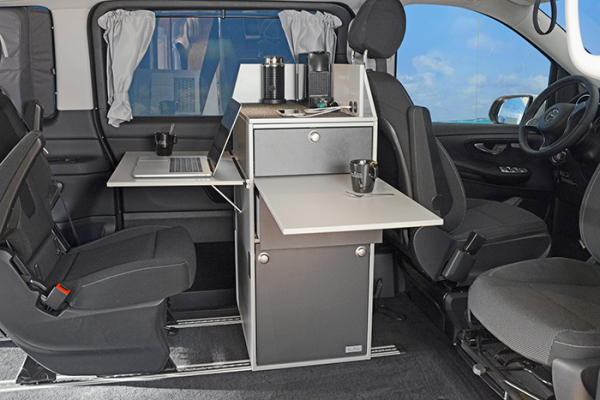 Coffee bar in the van with tables